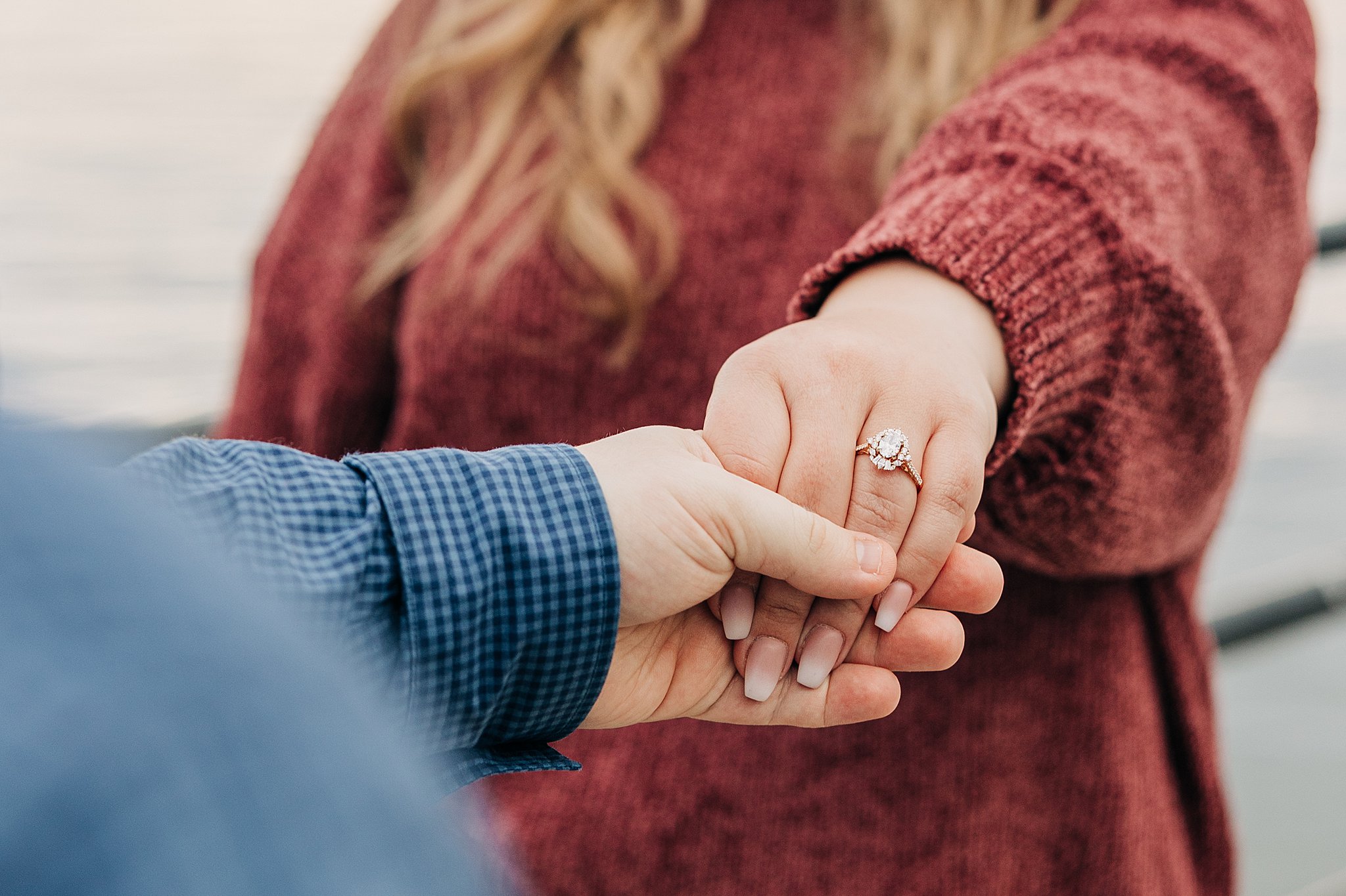 Details of a Man holding the ring hand of his new fiancee