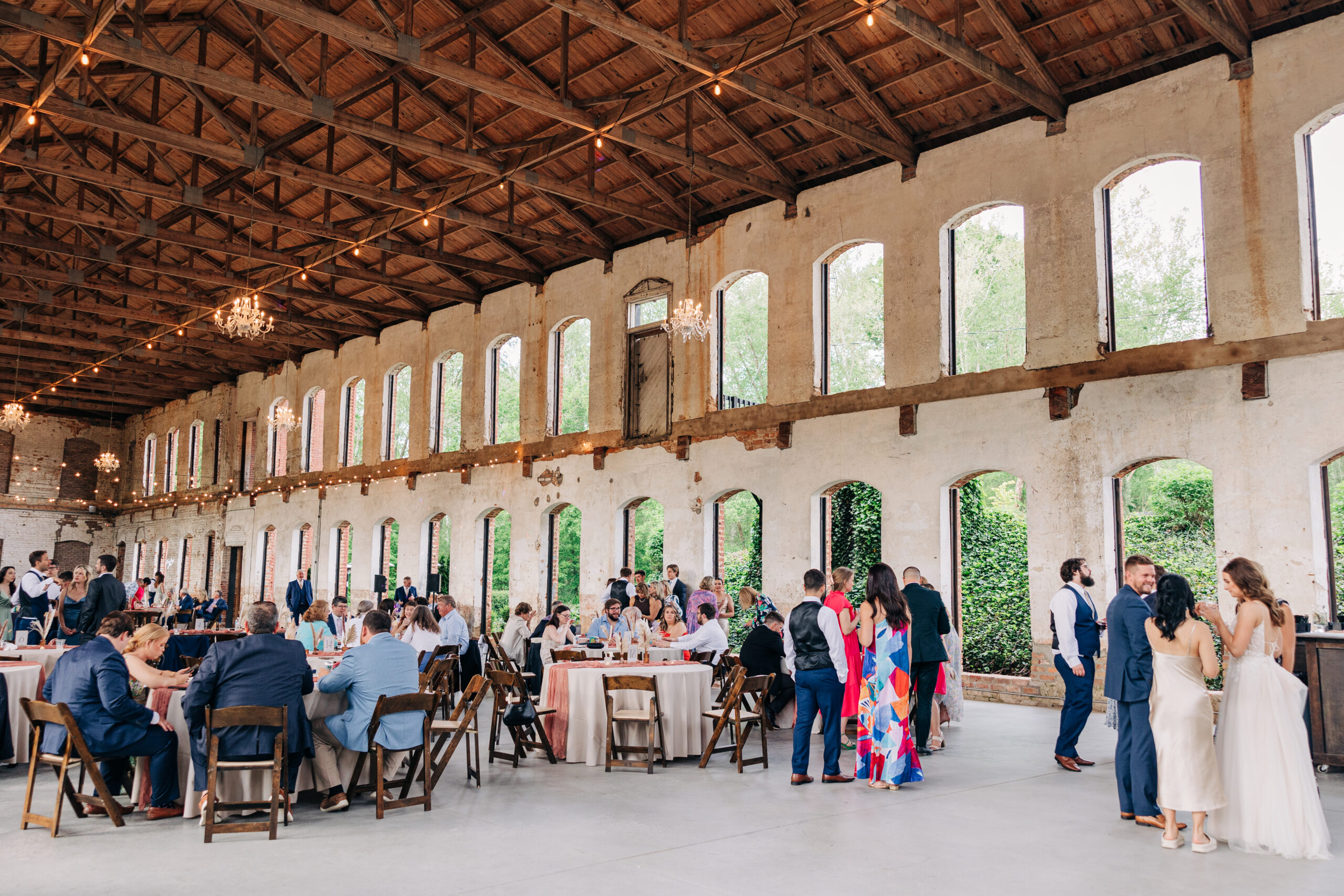 A view of an active wedding reception at the Providence Cotton Mill wedding venue