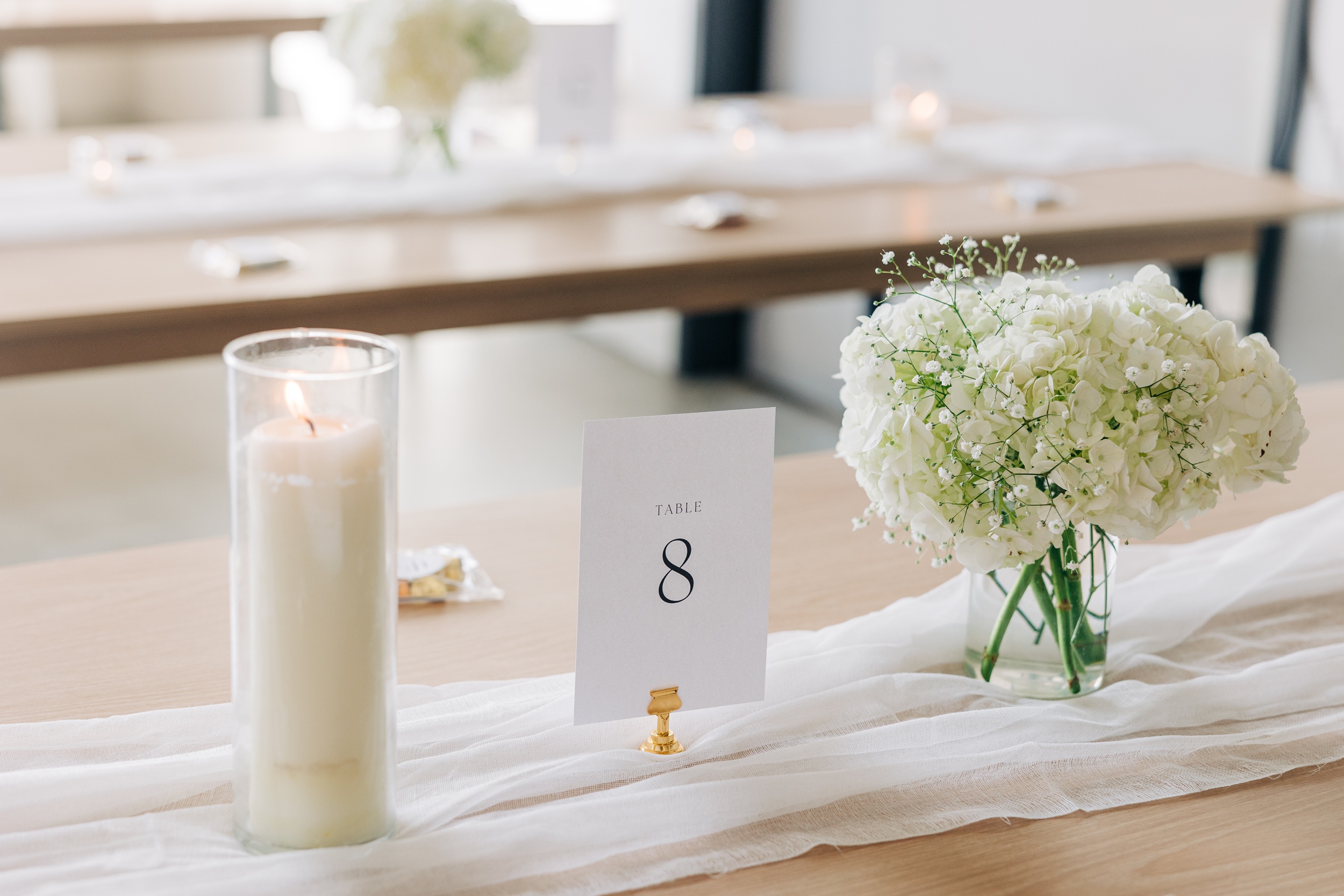 Details of a simple elegant wedding reception table at the pine wedding venue