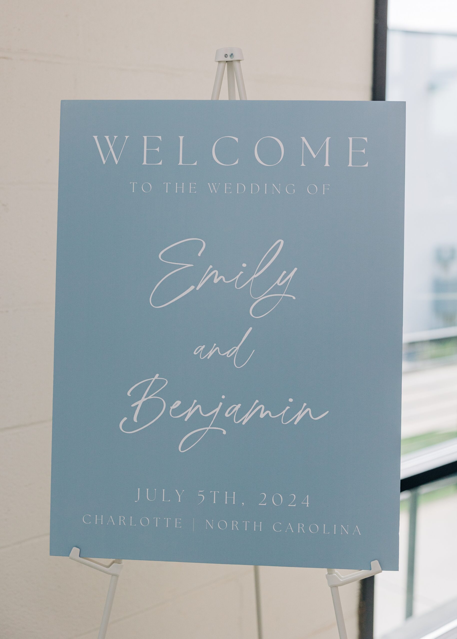 Details of a wedding welcome sign that is blue