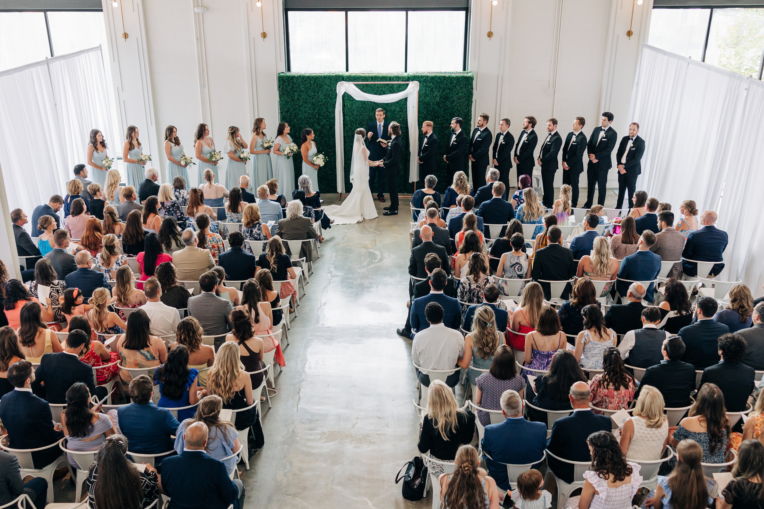 A view from above of a pine wedding venue ceremony taking place