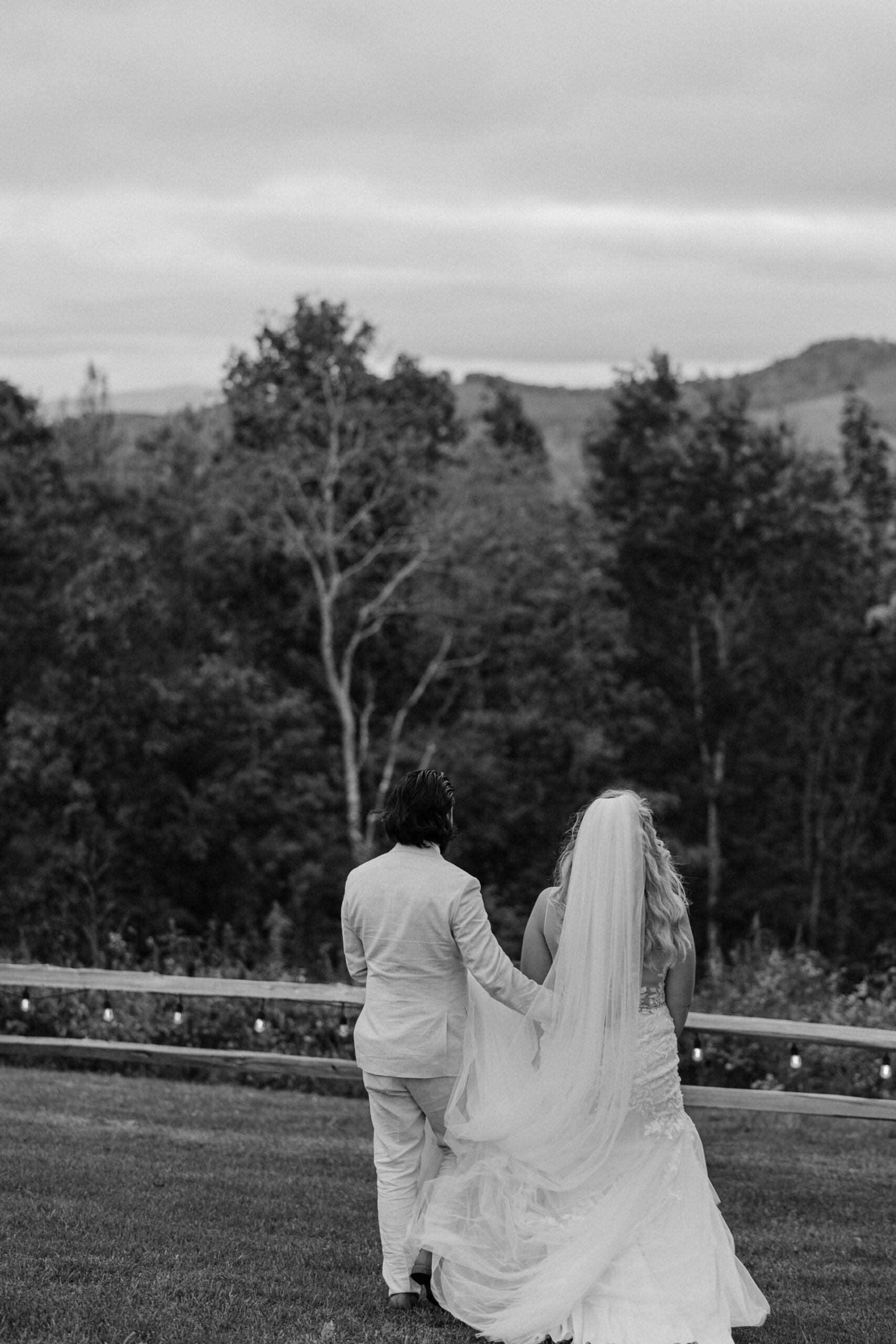 A bride and groom admire the mountain view of the appalachian view wedding venue