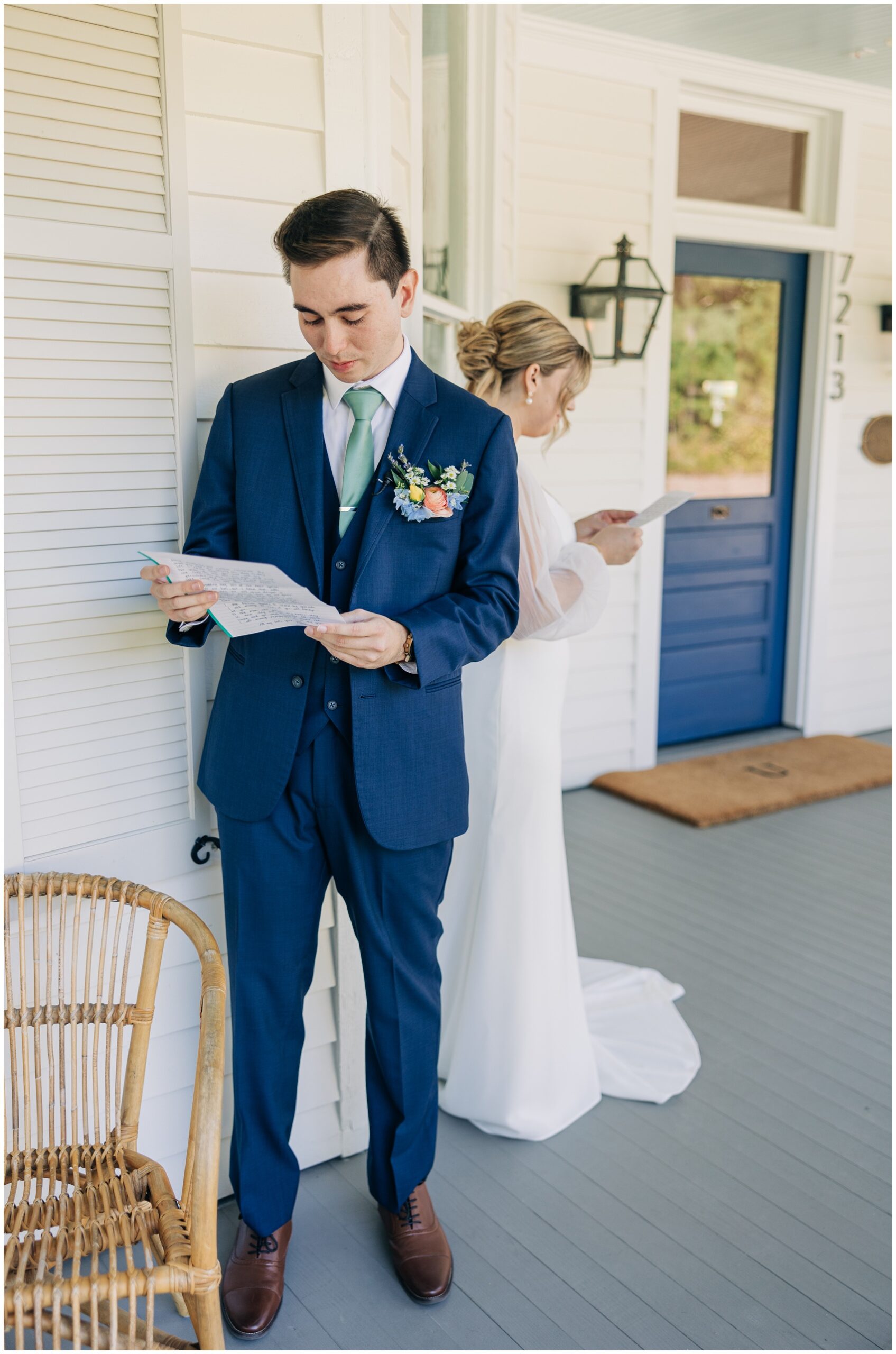 A bride and groom read letters to each other on the porch without seeing each other