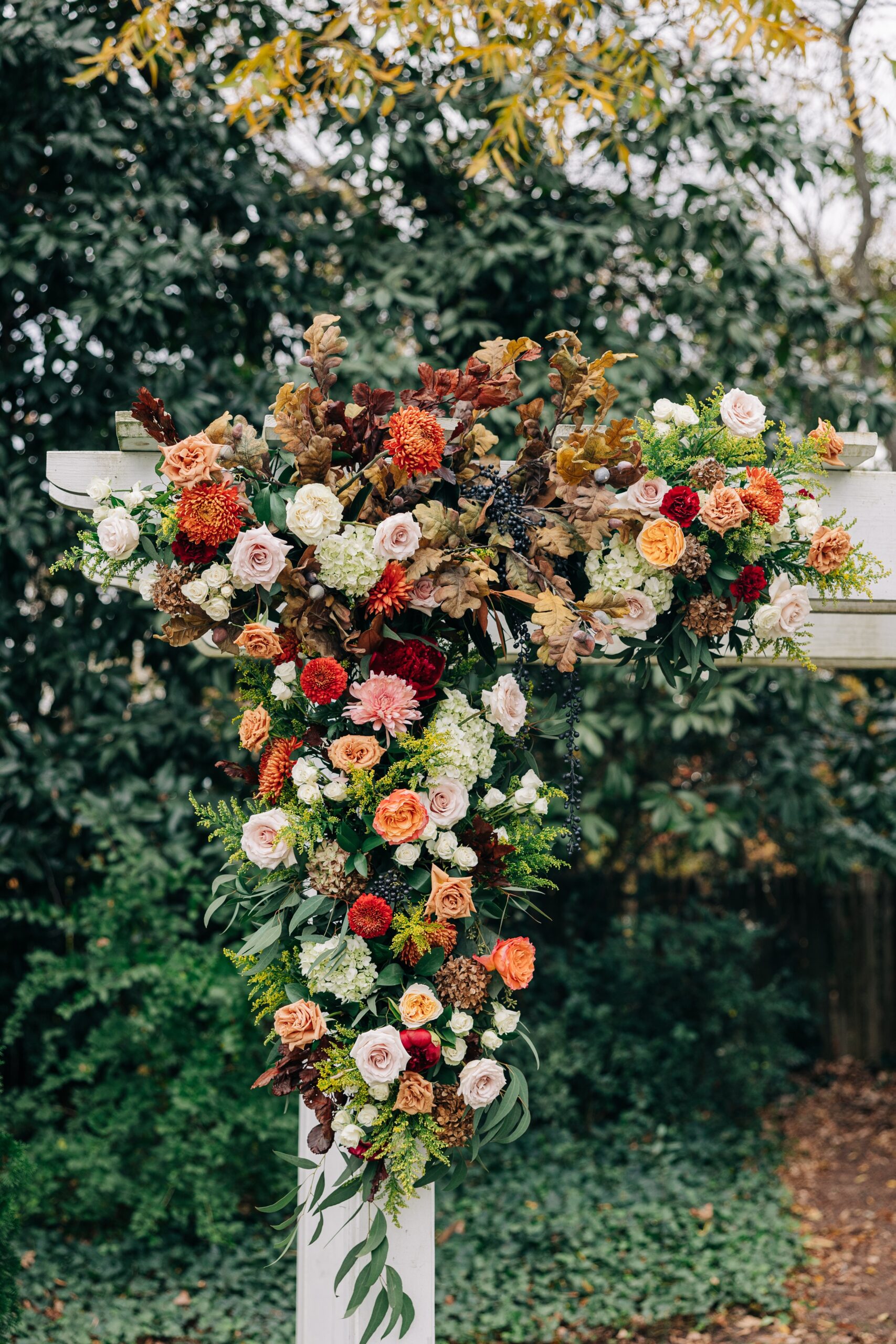 Details of florals on a ceremony arbor