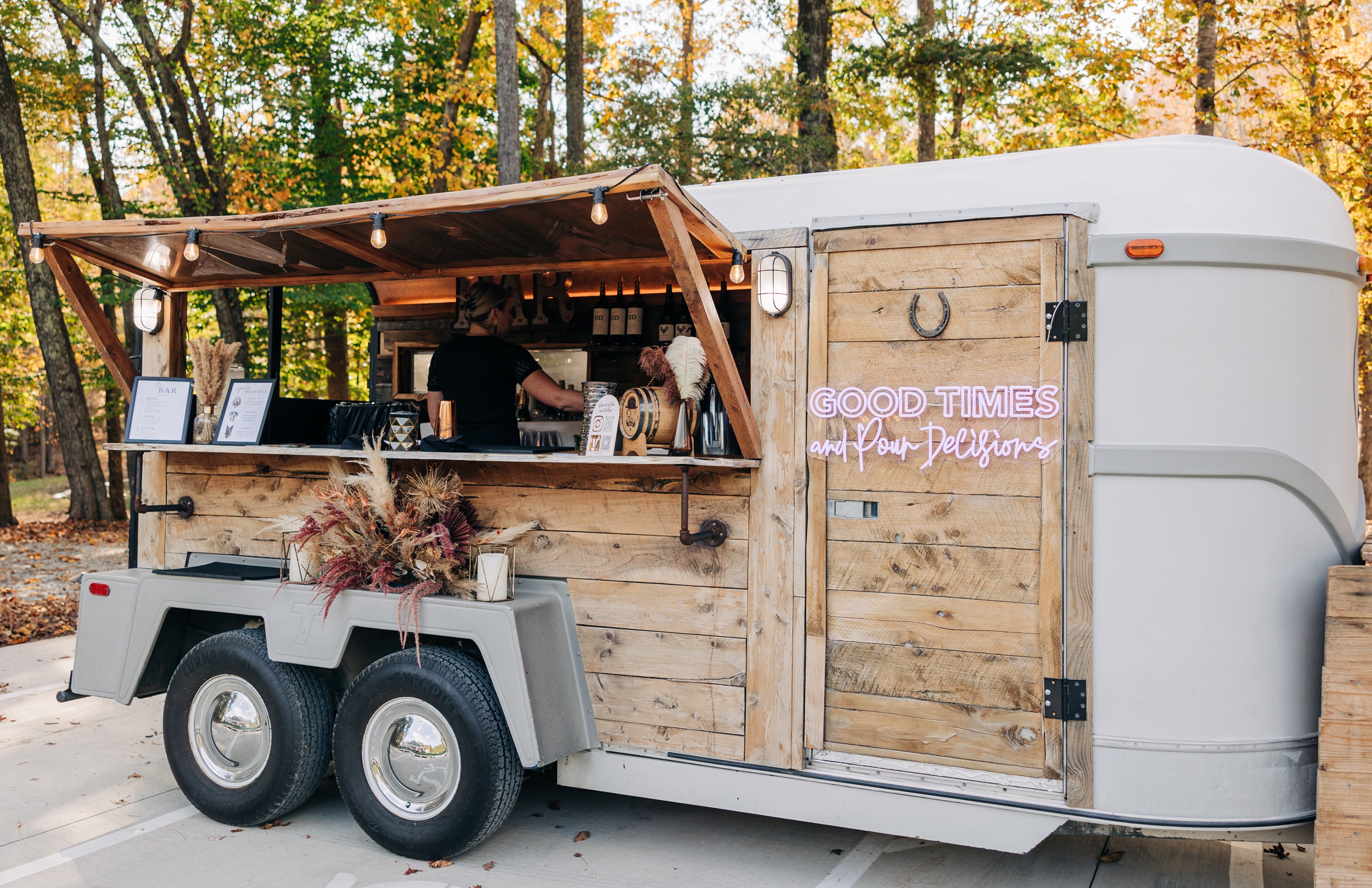 A mobile bar in a trailer set up on a patio