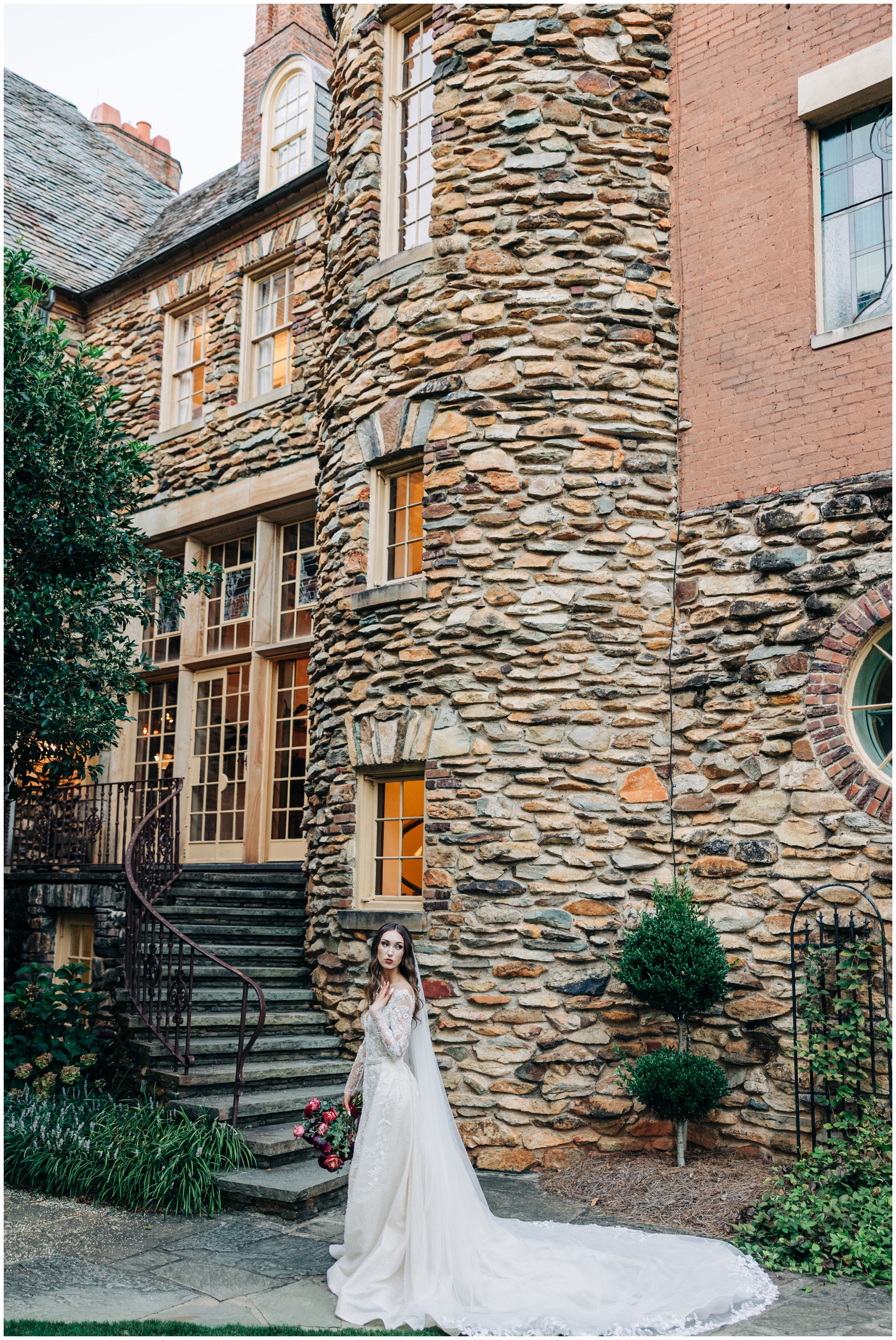 A bride looks back over her shoulder while walking the gardens of one of the Winston Salem Wedding Venues