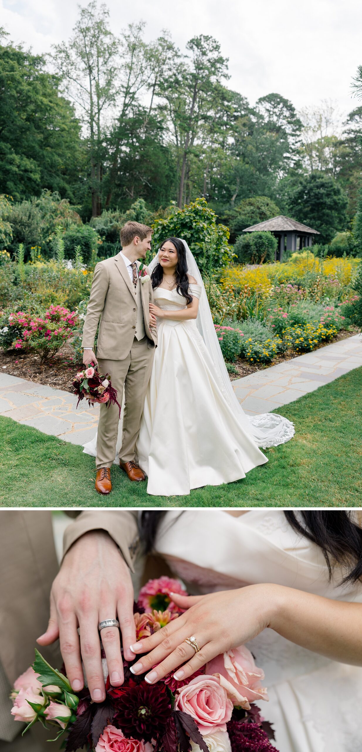 newlyweds smile at each other in a garden at the barn at reynolda village wedding venue above them showing off rings